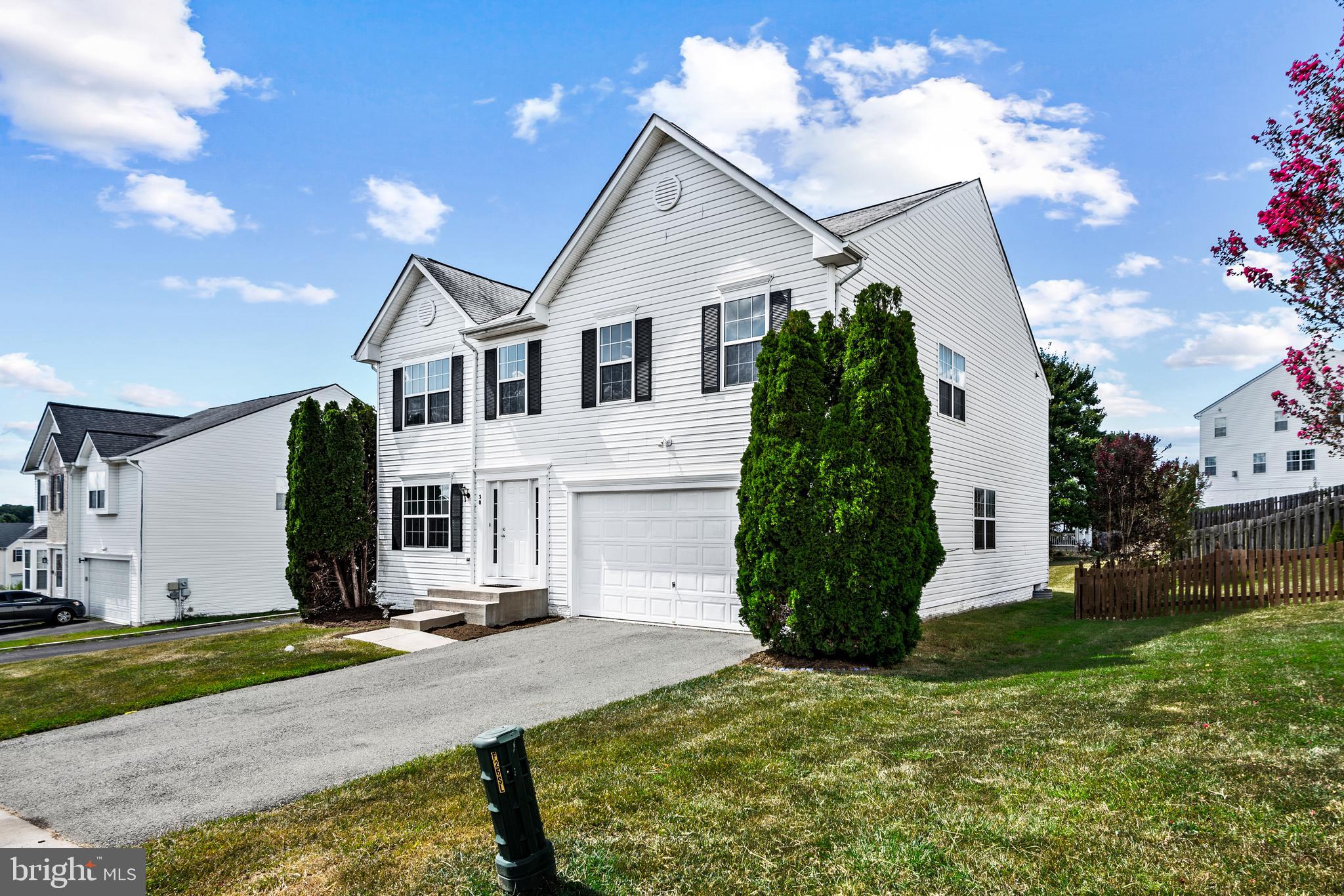 30 Stanley Loop Fredericksburg, VA 22406 - Photo 2 of 45 a view of a white house with a yard and plants