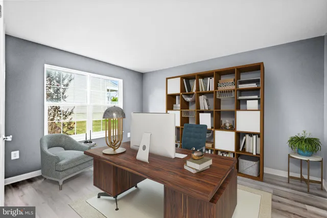 a workspace with furniture and a potted plant