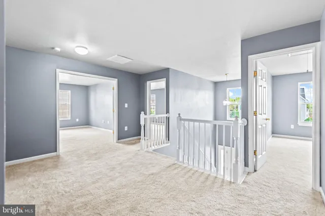 a view of a hallway with closet area