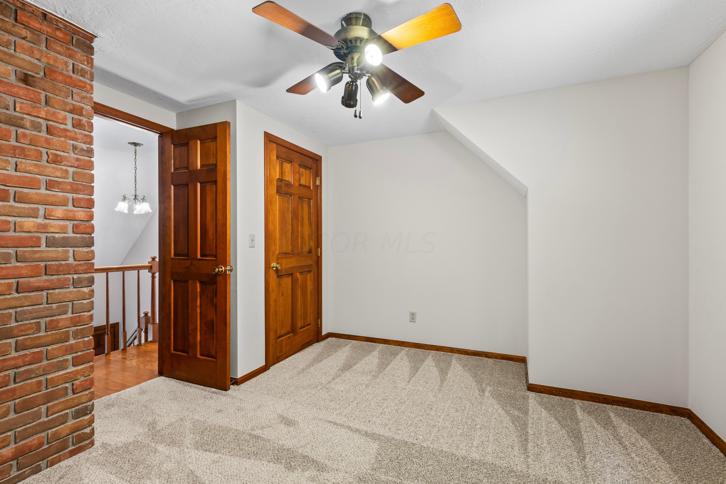 6940 Graham Road Mount Vernon, OH 43050 - Photo 43 of 70 • New light sand carpet
~ 06/2024
• Ivory painted walls
• Lighted ceiling fan
• Single door closet with
attic access
• 2” wood blinds