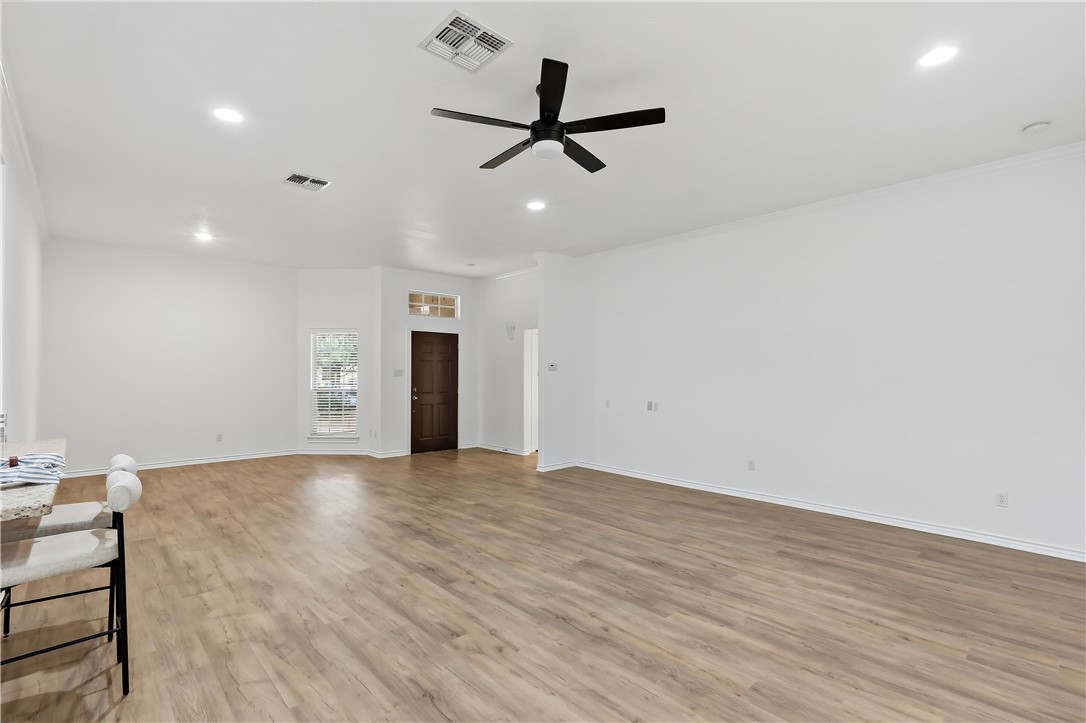 5310 Draycott Court Bryan, TX 77802 - Photo 11 of 31 a view of an empty room with a ceiling fan