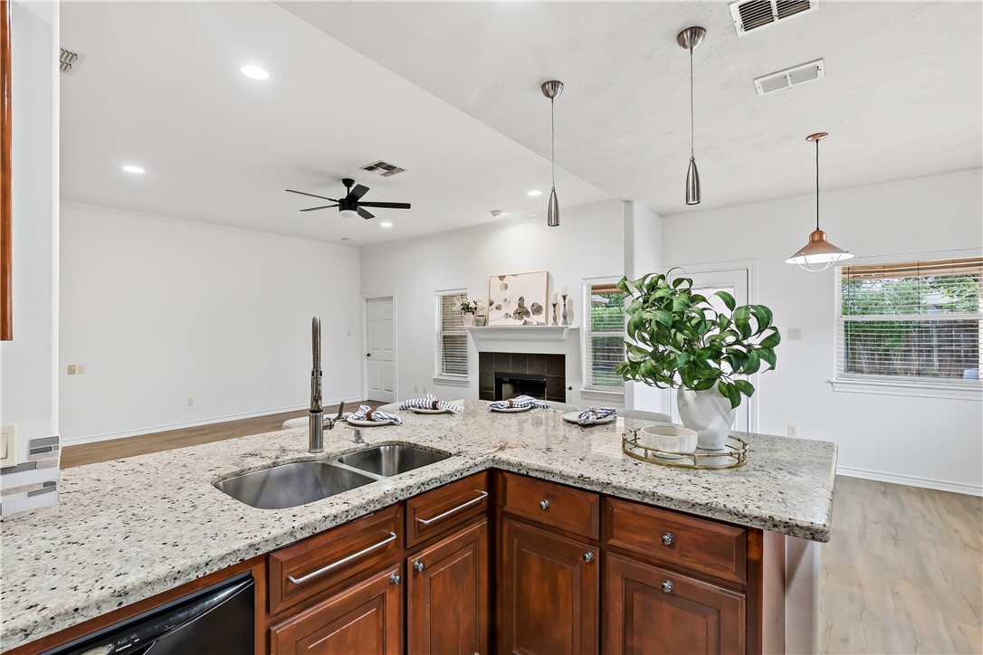 5310 Draycott Court Bryan, TX 77802 - Photo 17 of 31 a kitchen with a sink a counter and cabinets