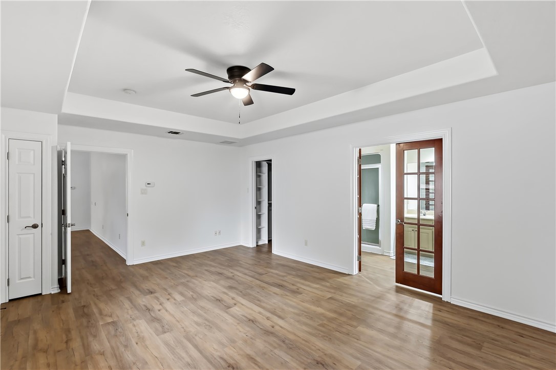 5310 Draycott Court Bryan, TX 77802 - Photo 23 of 31 a view of empty room with wooden floor and ceiling fan