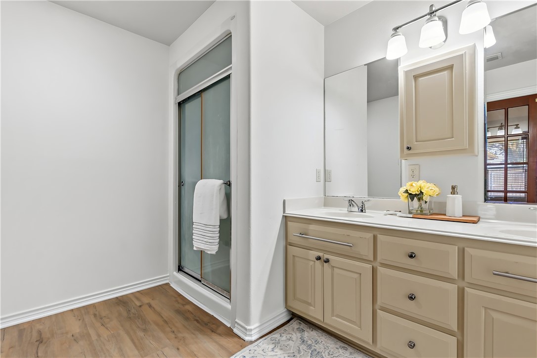 5310 Draycott Court Bryan, TX 77802 - Photo 25 of 31 a bathroom with a double vanity sink and mirror