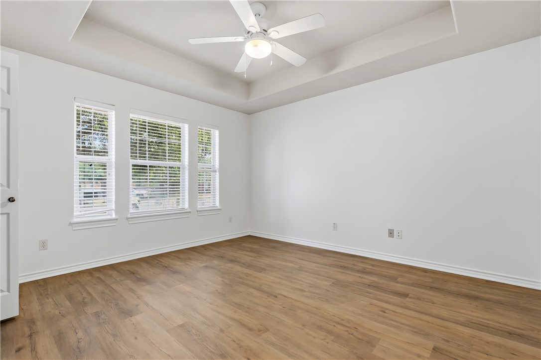 5310 Draycott Court Bryan, TX 77802 - Photo 26 of 31 an empty room with wooden floor and windows