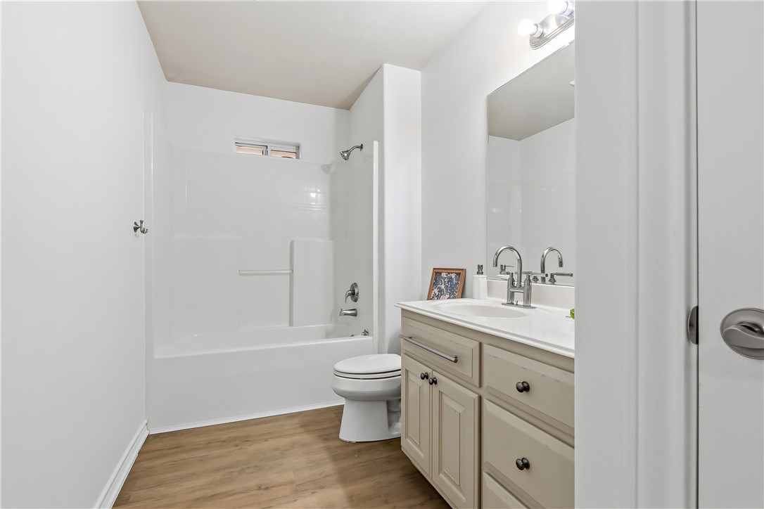 5310 Draycott Court Bryan, TX 77802 - Photo 27 of 31 a bathroom with a sink a toilet and shower