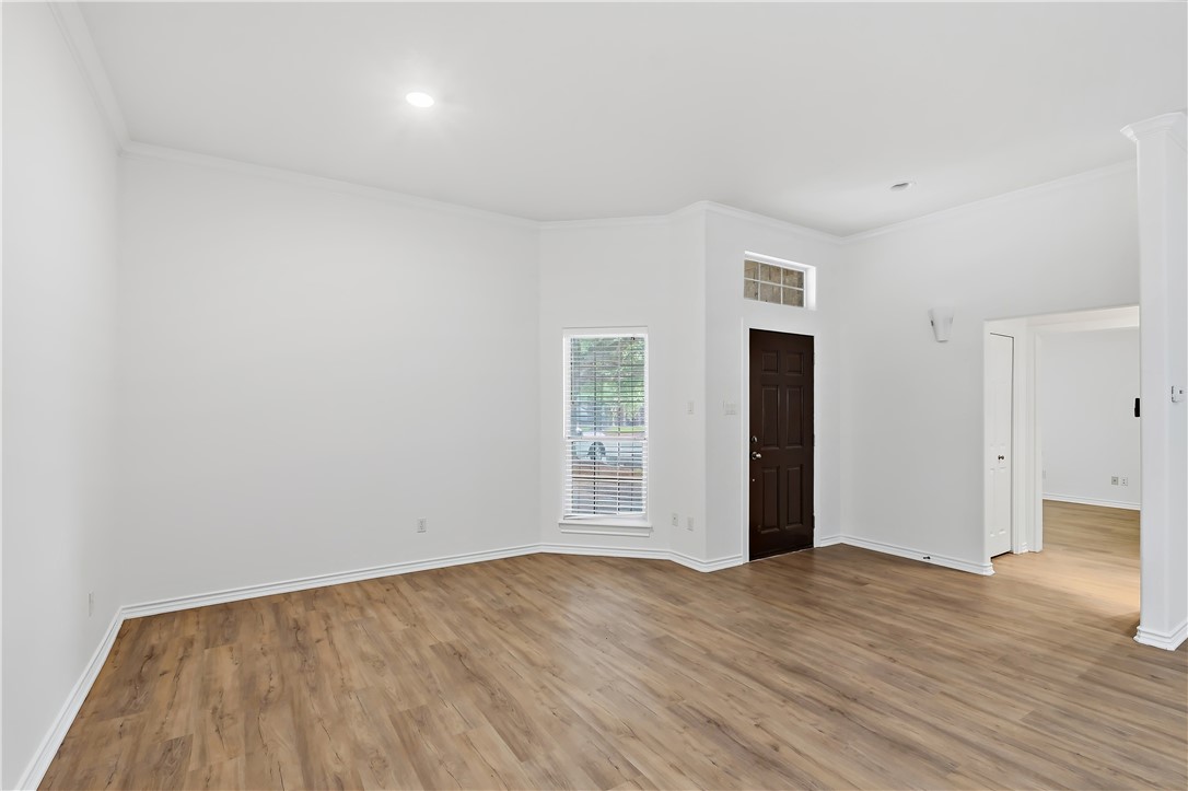 5310 Draycott Court Bryan, TX 77802 - Photo 8 of 31 an empty room with wooden floor and windows