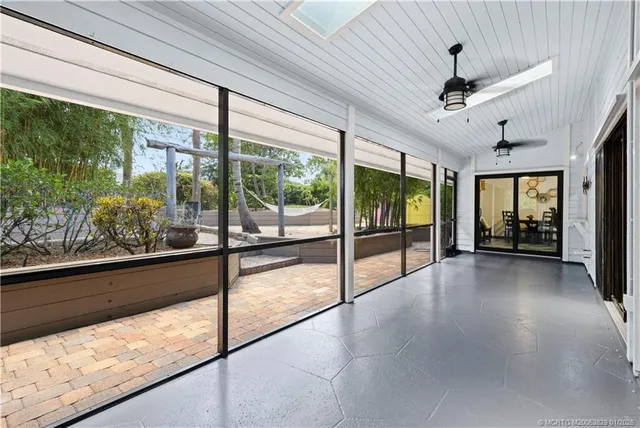 a view of an entryway with a floor to ceiling window