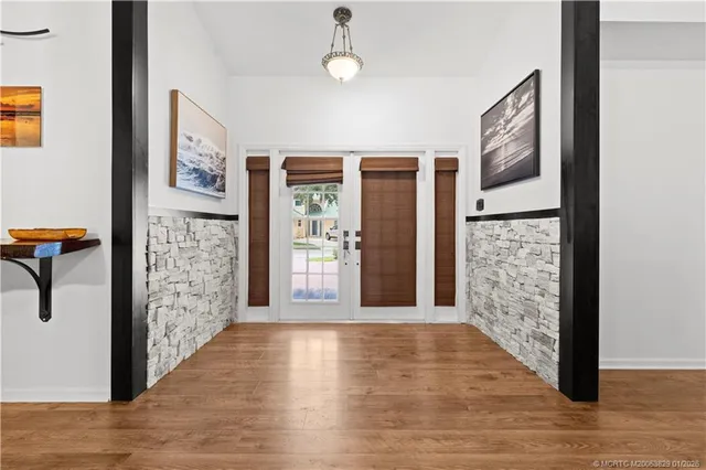 a view of gallery with wooden floor