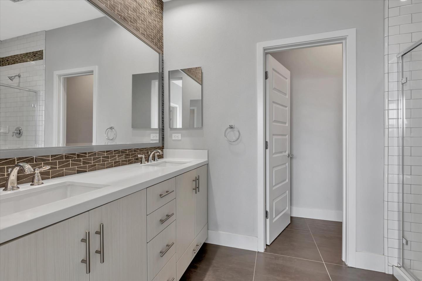 5533 Azalea Way Newark, CA 94560 - Photo 45 of 64 a bathroom with a double vanity sink and a mirror