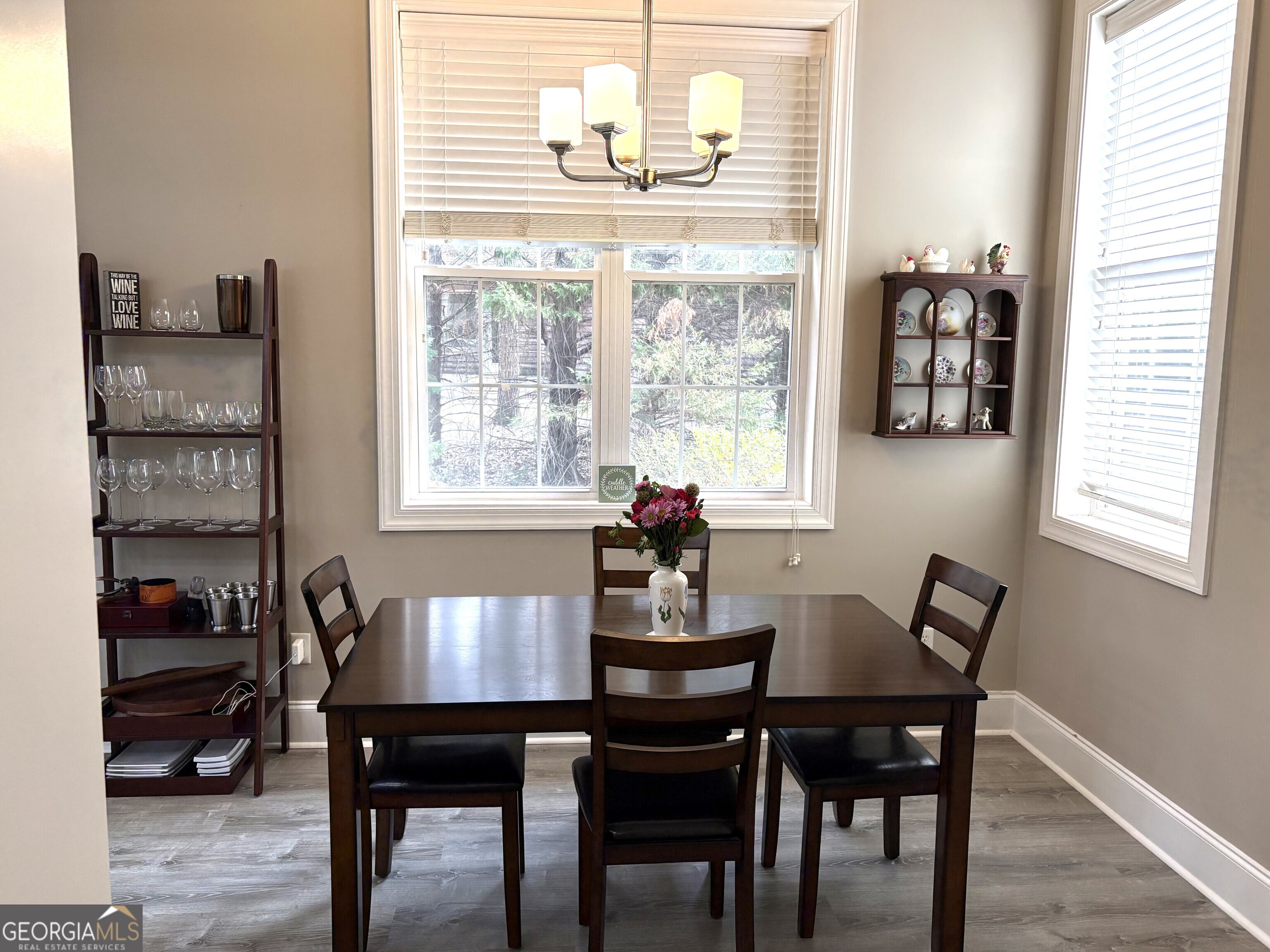 303 Winchester Court Dublin, GA 31021 - Photo 12 of 40 a view of a dining room with furniture and windows
