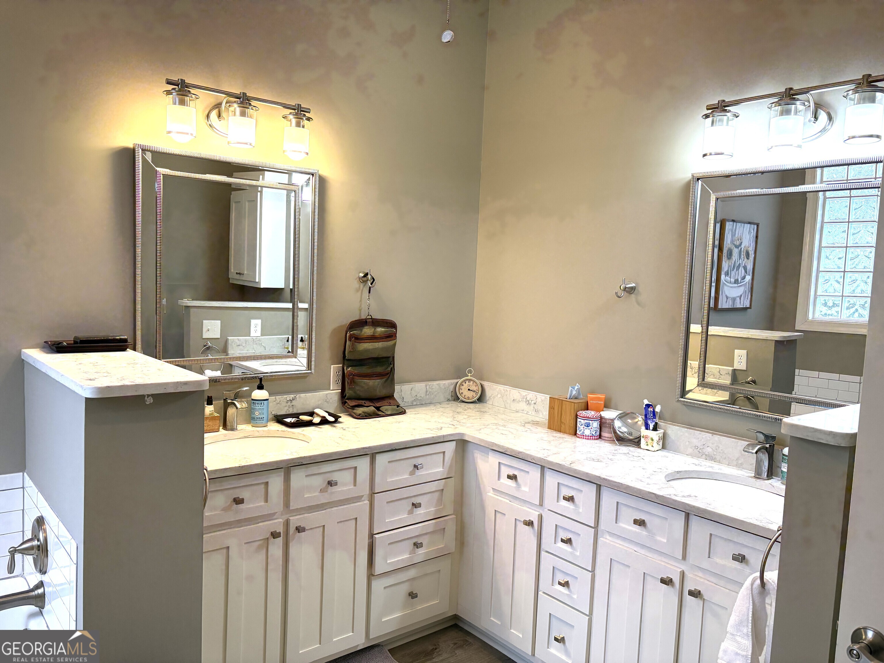 303 Winchester Court Dublin, GA 31021 - Photo 16 of 40 a bathroom with a sink vanity and mirror