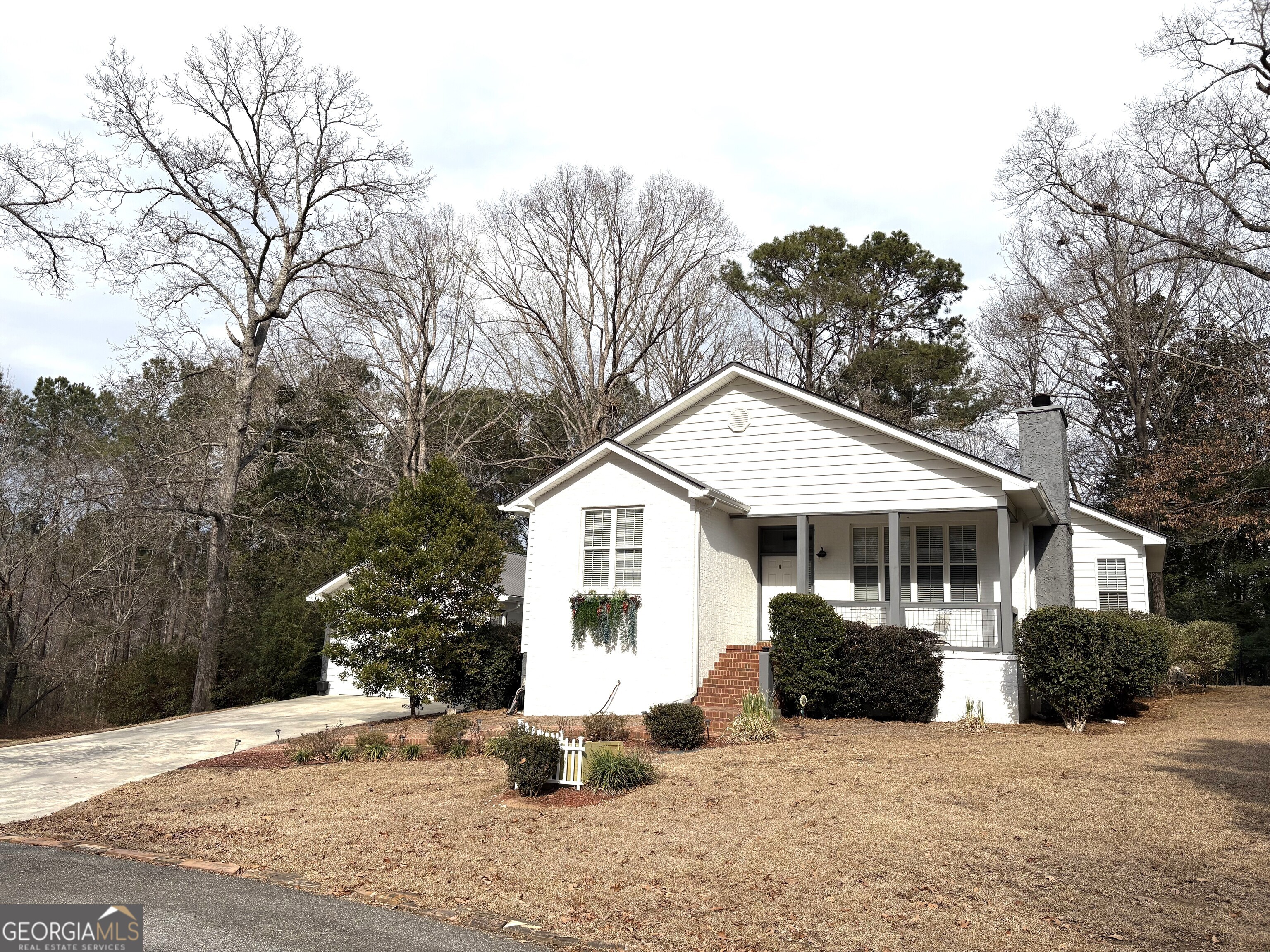 303 Winchester Court Dublin, GA 31021 - Photo 2 of 40 a view of a house with a patio