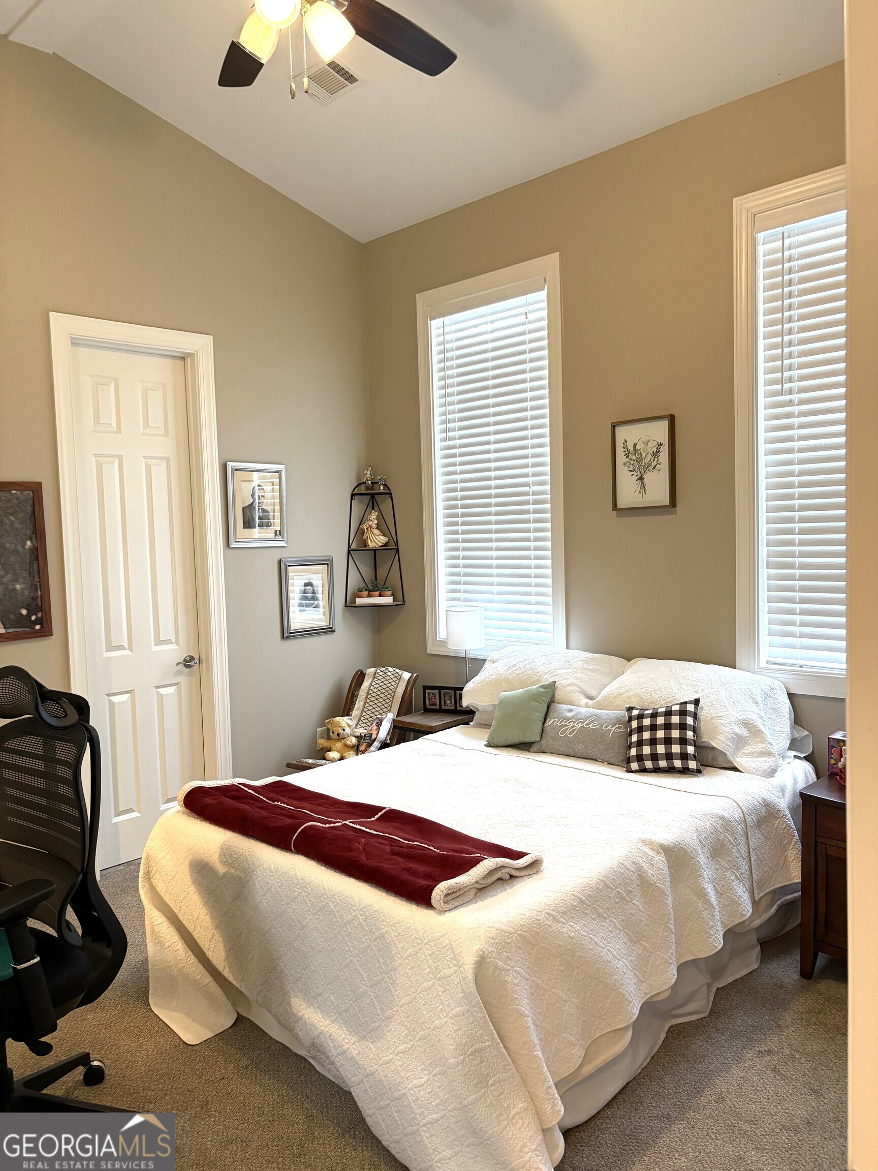 303 Winchester Court Dublin, GA 31021 - Photo 21 of 40 a bedroom with a bed and window