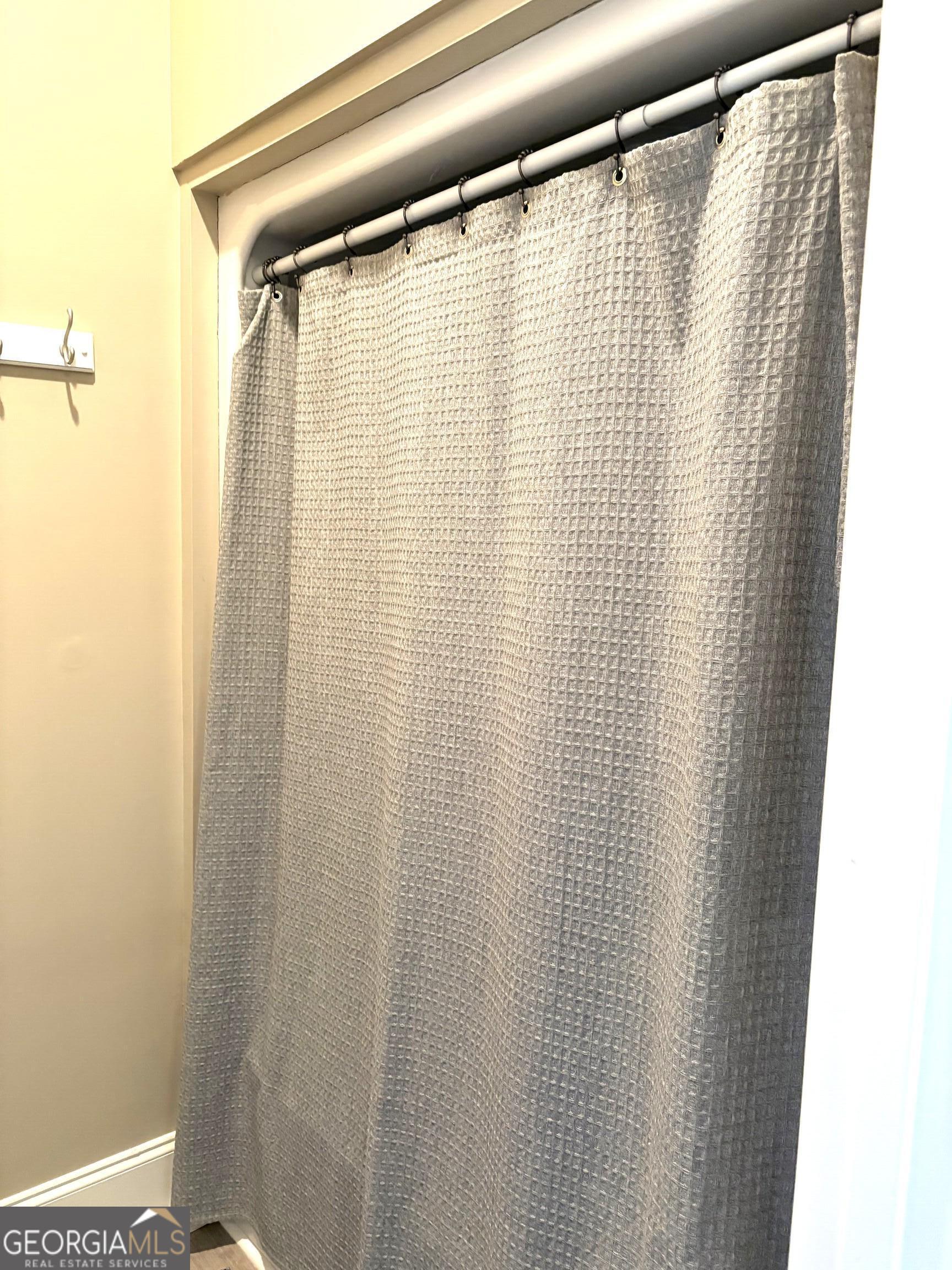 303 Winchester Court Dublin, GA 31021 - Photo 22 of 40 a view of a shower curtain