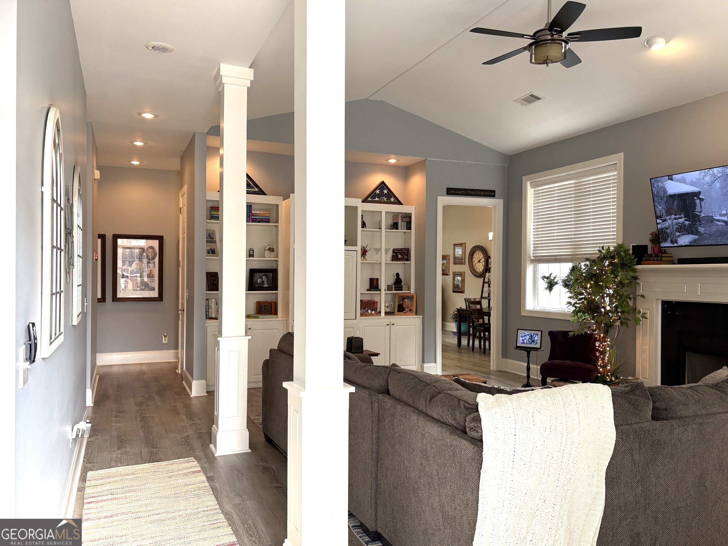 303 Winchester Court Dublin, GA 31021 - Photo 3 of 40 a living room with furniture and a fireplace