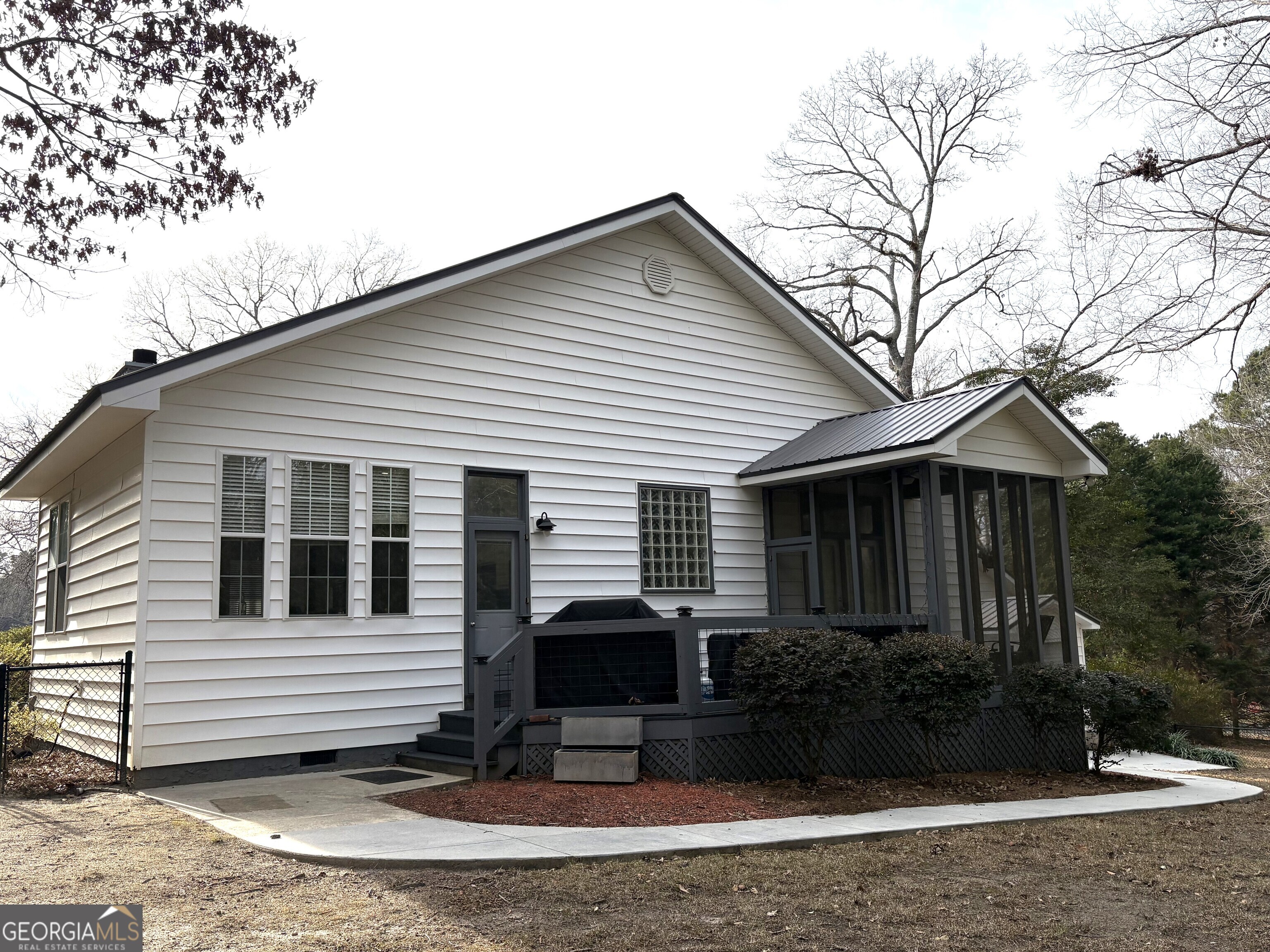 303 Winchester Court Dublin, GA 31021 - Photo 32 of 40 a view of a house with a yard