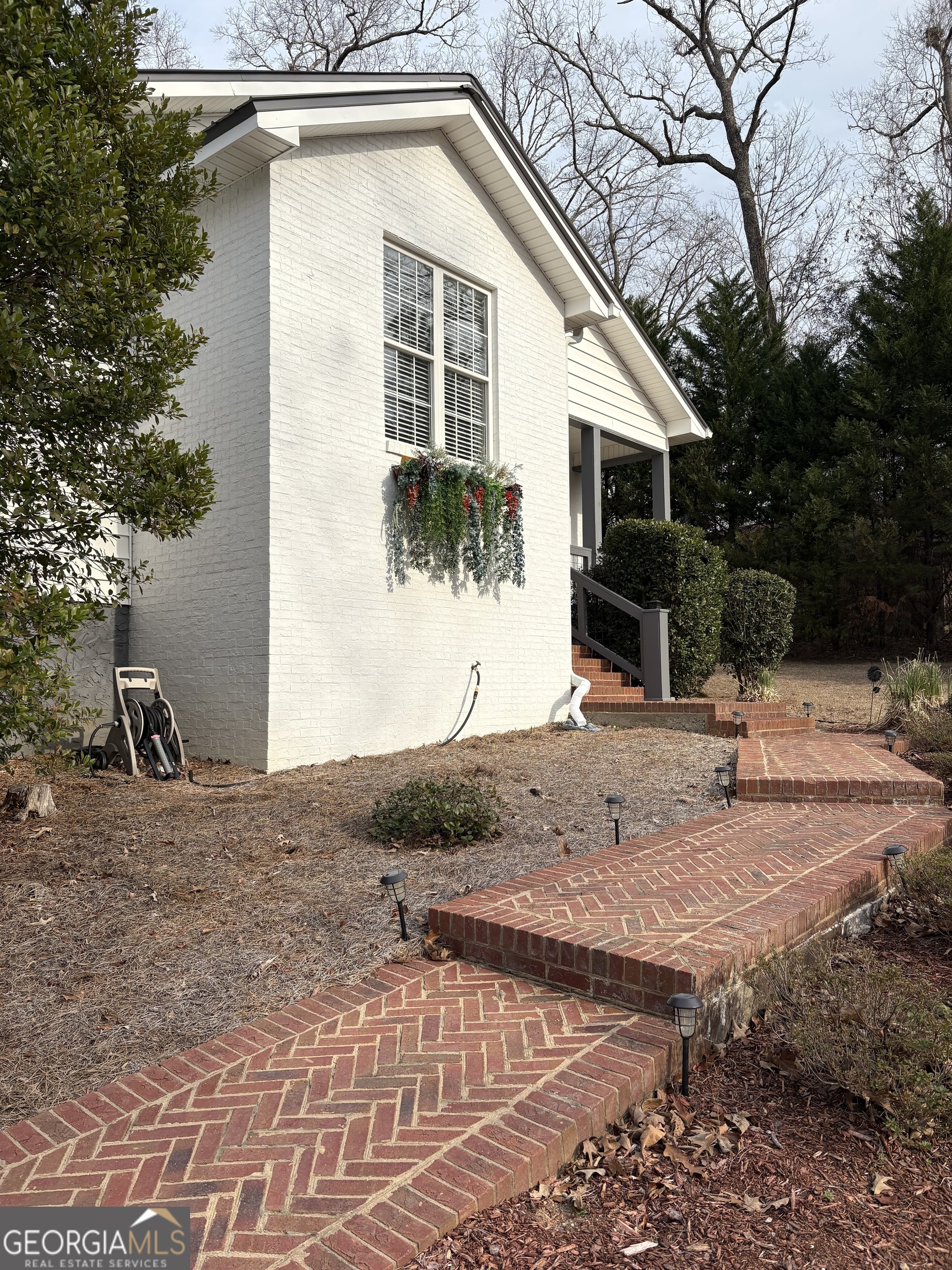 303 Winchester Court Dublin, GA 31021 - Photo 38 of 40 a view of a backyard with large trees