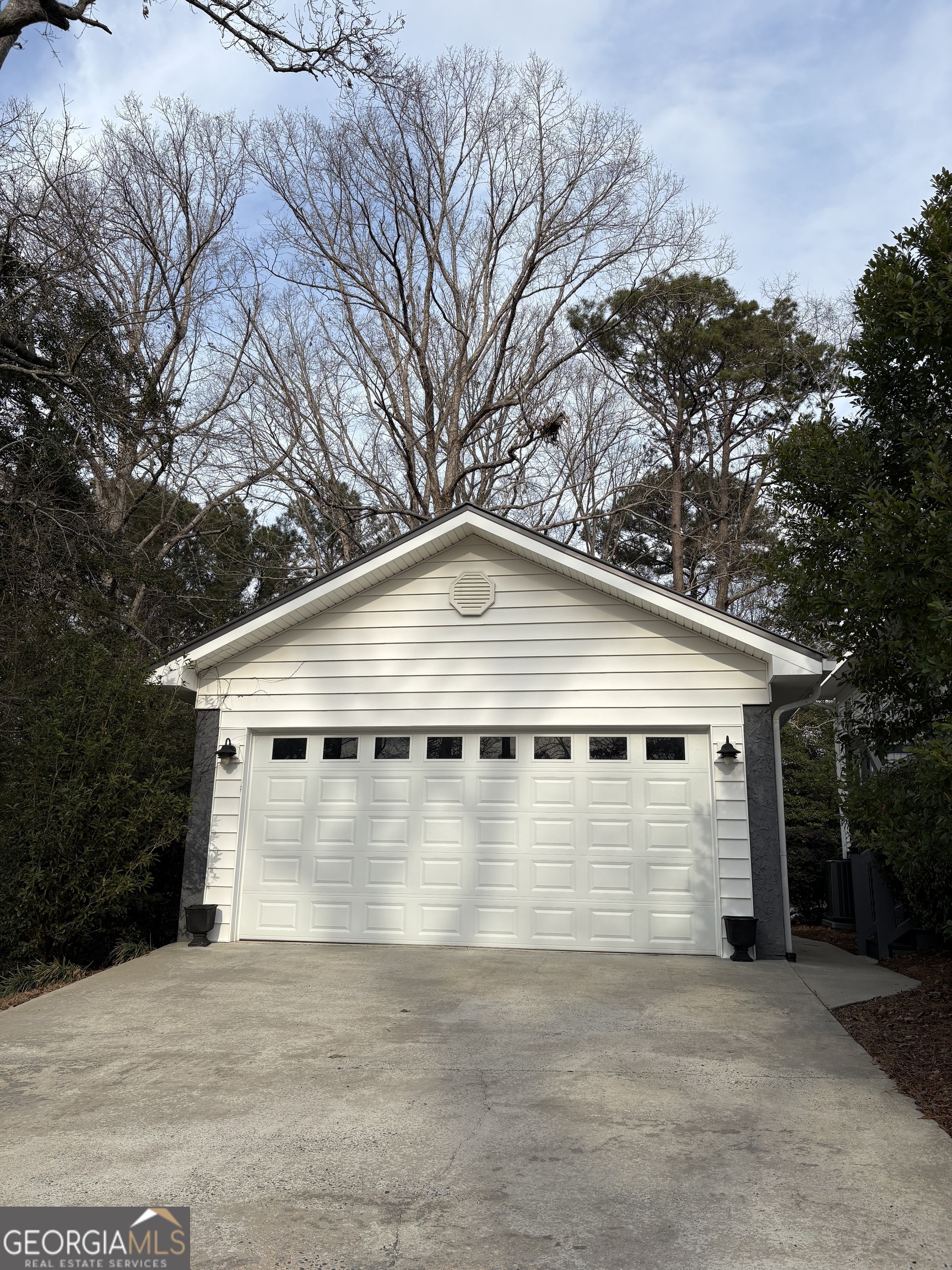 303 Winchester Court Dublin, GA 31021 - Photo 39 of 40 a front view of a house with a yard and large trees