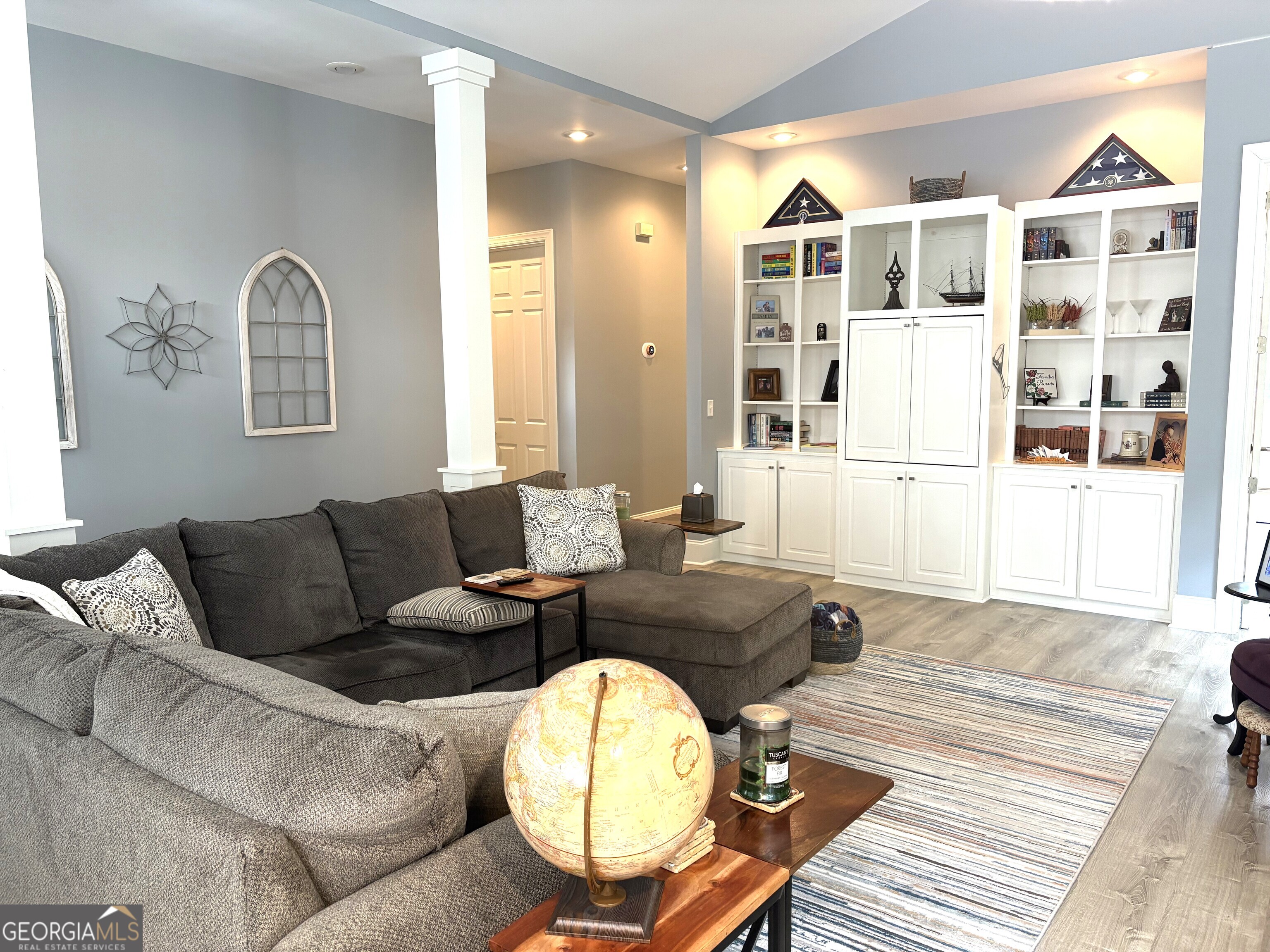 303 Winchester Court Dublin, GA 31021 - Photo 5 of 40 a living room with furniture and wooden floor