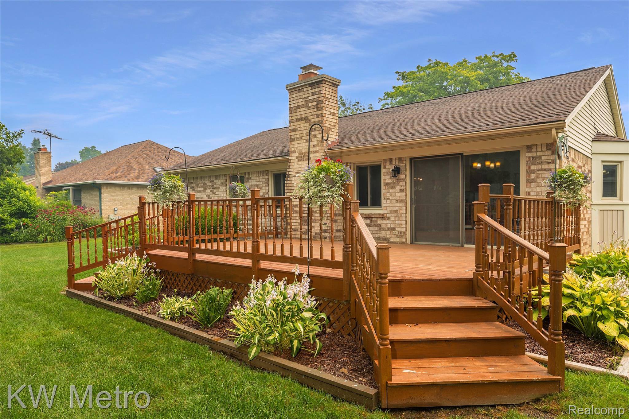 2154 Warrington Road Rochester, MI 48307 - Photo 4 of 41 Spacious multi-level wood deck with baluster railings and integrated steps