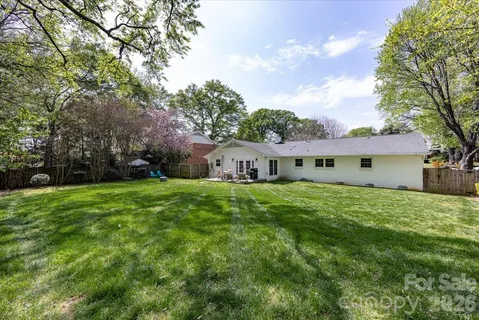 a view of a house with garden and yard