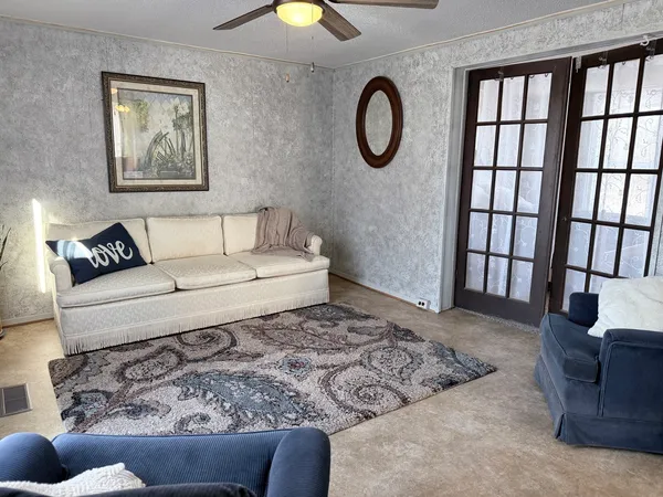 a living room with furniture and a window