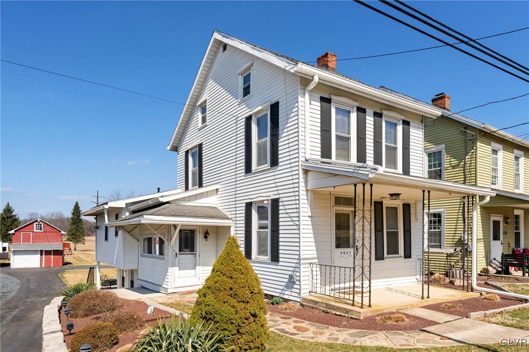 4651 Huckleberry Road Orefield, PA 18069 - Photo 1 of 30 a front view of a house with a porch