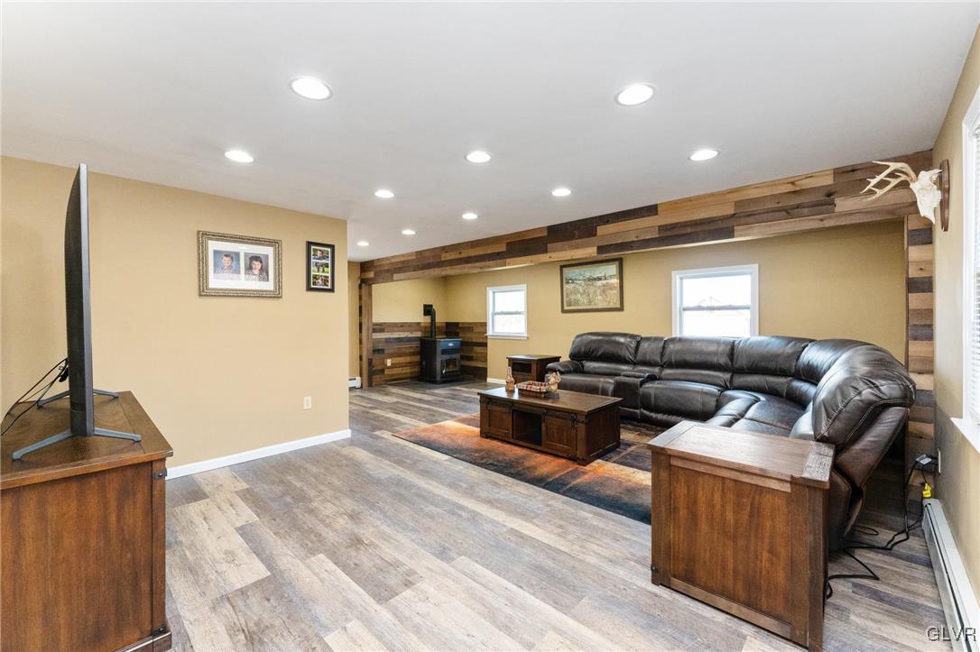 4651 Huckleberry Road Orefield, PA 18069 - Photo 11 of 30 a living room with furniture and a flat screen tv