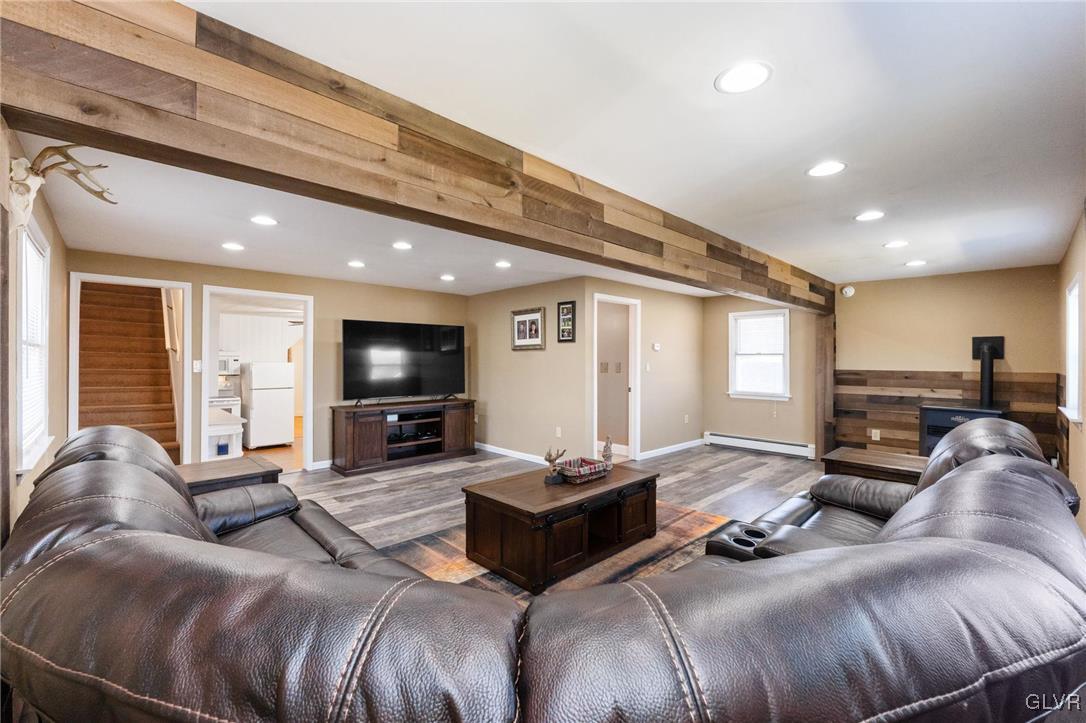 4651 Huckleberry Road Orefield, PA 18069 - Photo 13 of 30 a living room with furniture and a flat screen tv