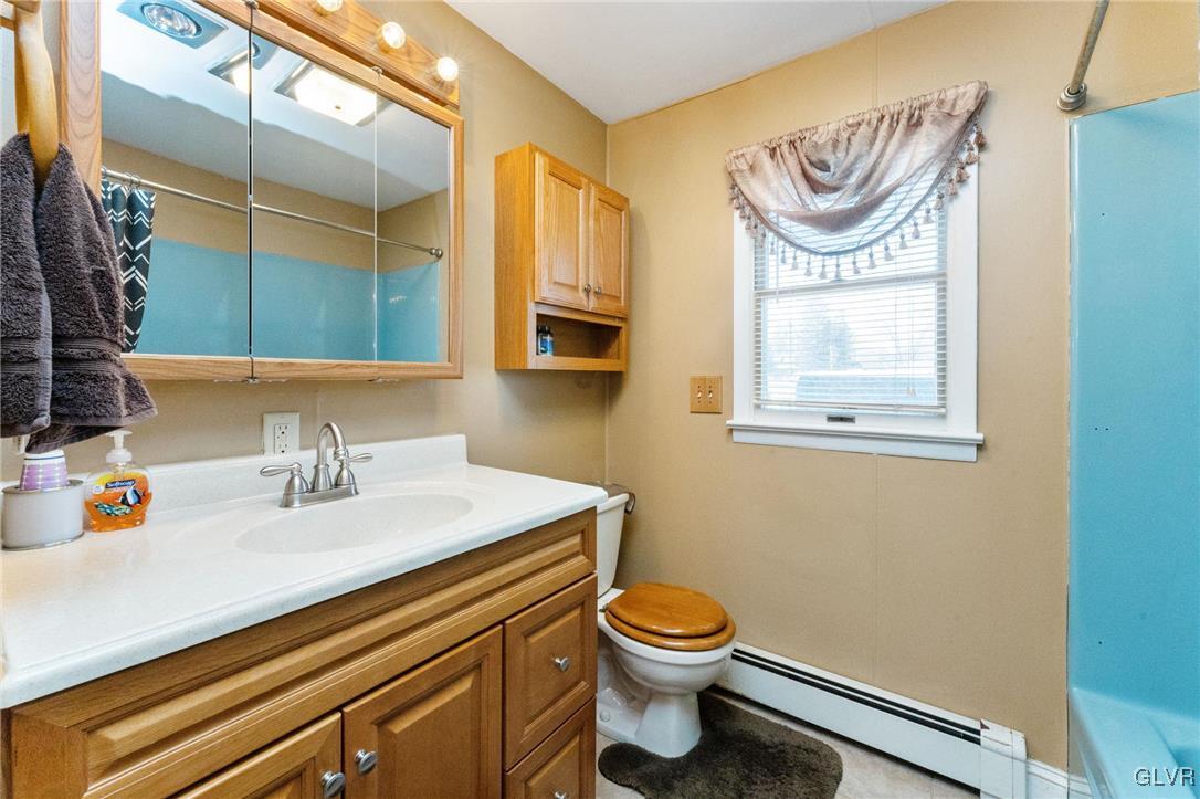 4651 Huckleberry Road Orefield, PA 18069 - Photo 15 of 30 a bathroom with a sink a mirror and a toilet