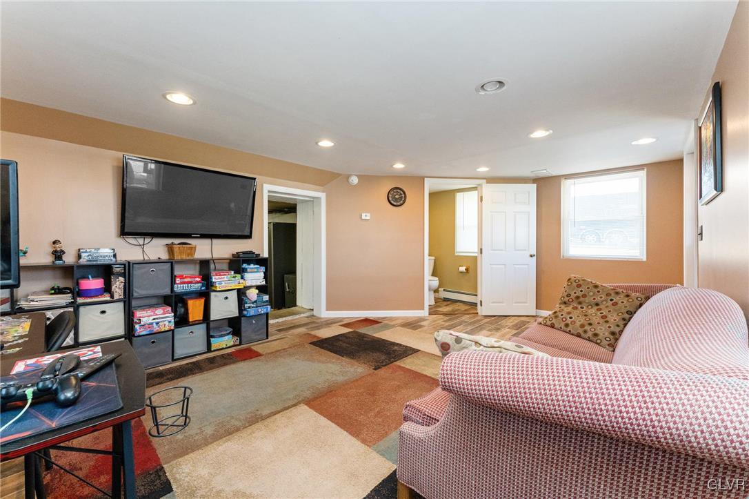 4651 Huckleberry Road Orefield, PA 18069 - Photo 23 of 30 a living room with furniture and a flat screen tv