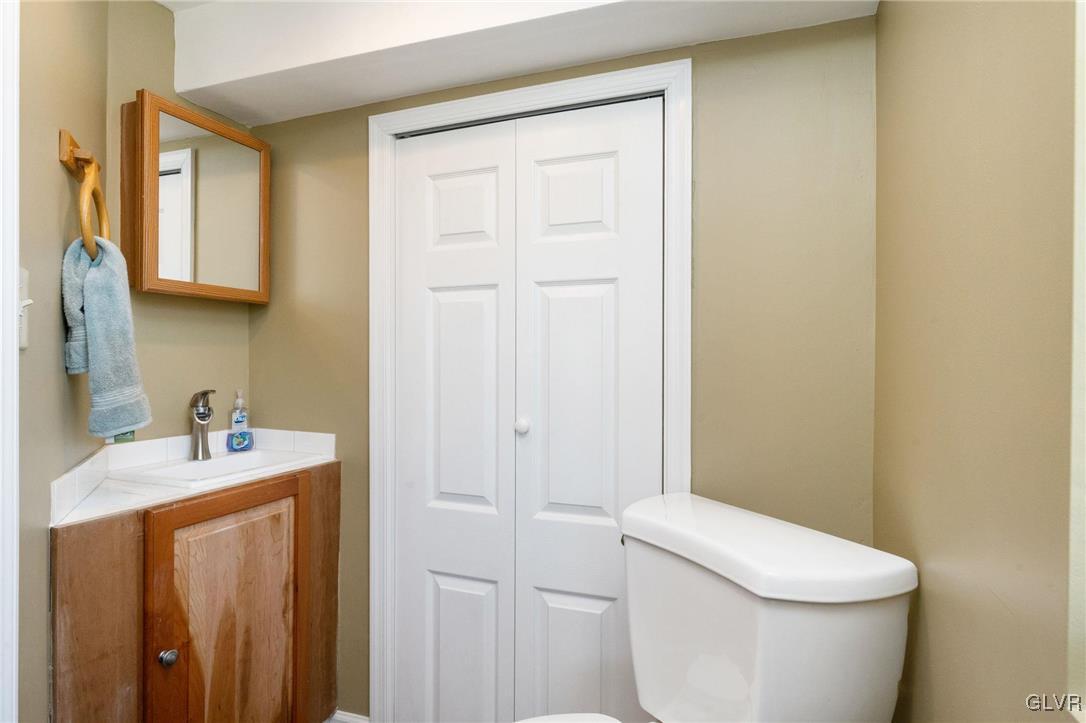 4651 Huckleberry Road Orefield, PA 18069 - Photo 24 of 30 a bathroom with a sink a toilet and a mirror