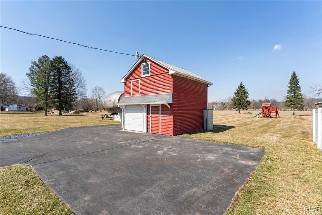 4651 Huckleberry Road Orefield, PA 18069 - Photo 28 of 30 a view of a house with a yard