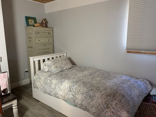 1 Sandy Way Gloucester, MA 01930 - Photo 10 of 14 a bed sitting in a bedroom next to a window and dresser
