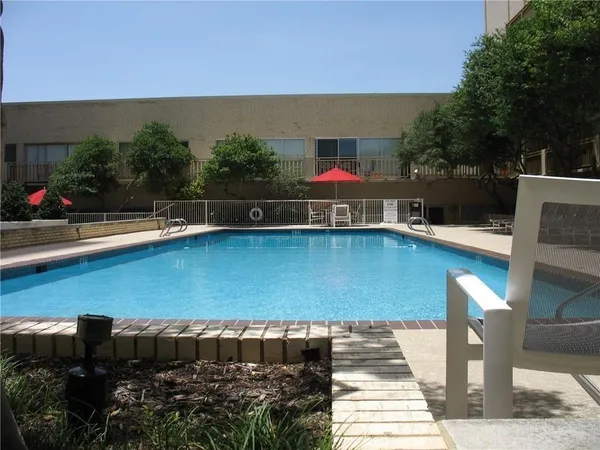 a view of a chairs and table in th patio