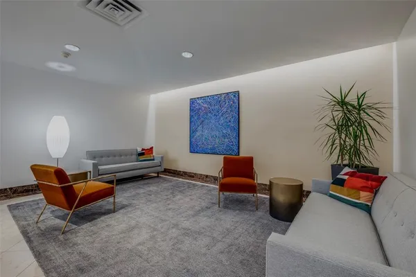 a living room with furniture gym equipment and a view of living room