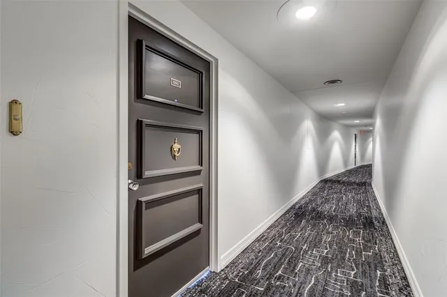 a view of a kitchen with a sink and a refrigerator