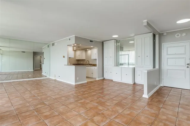 a view of a kitchen with a sink and cabinets