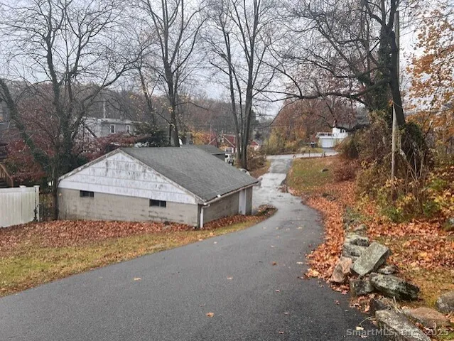 a view of a house with large trees