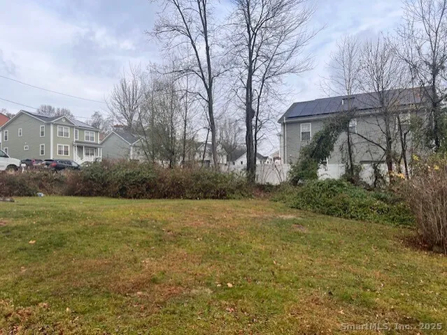a view of a yard in front of a house