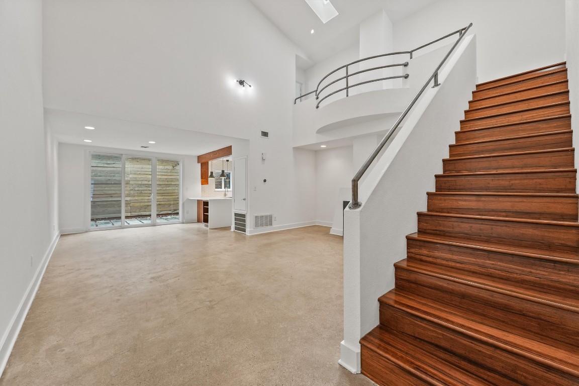 2321 Commonwealth Street Houston, TX 77006 - Photo 2 of 16 High ceilings and skylights bring in an abundance of light to this grand living room.