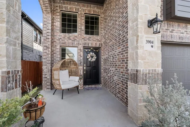 a bench sitting in front of a building