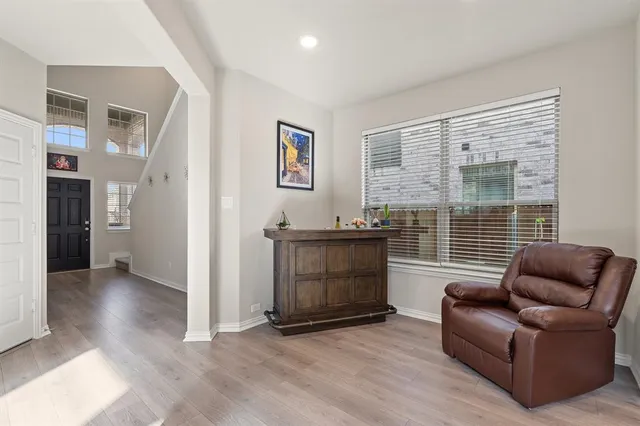 a living room with furniture and a window