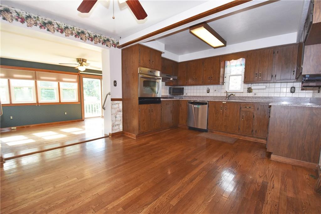 2014 Borland Road Pittsburgh, PA 15243 - Photo 6 of 25 a kitchen with stainless steel appliances granite countertop a stove a sink and a refrigerator