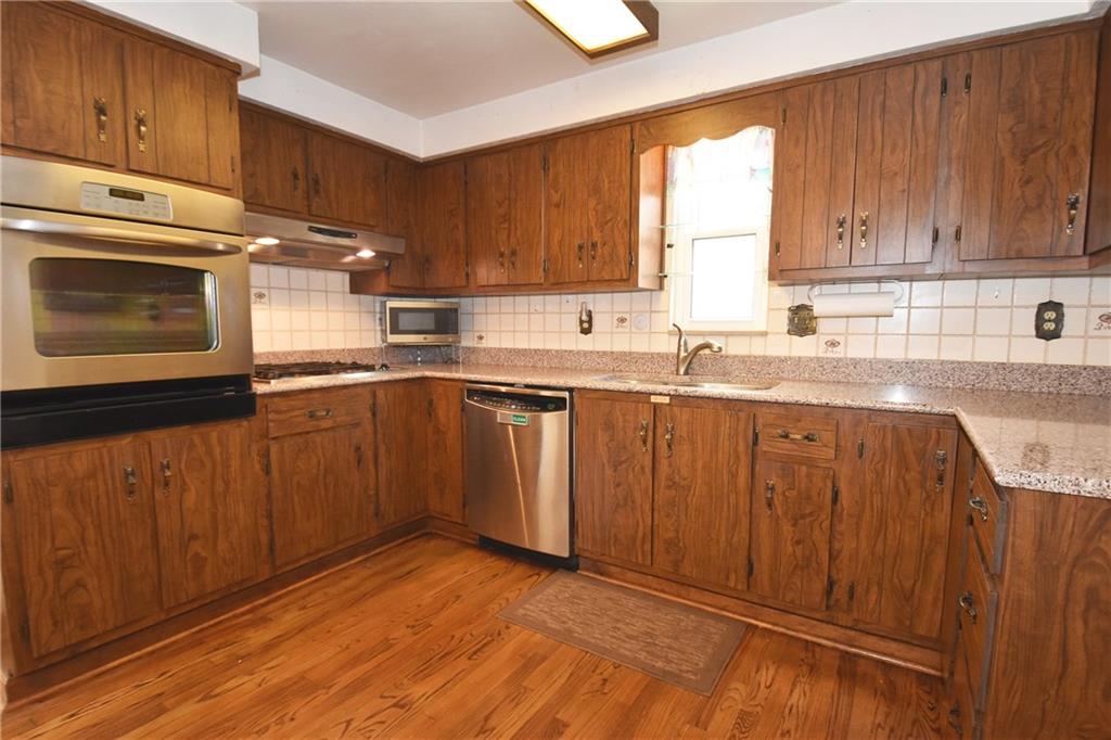 2014 Borland Road Pittsburgh, PA 15243 - Photo 7 of 25 a kitchen with a sink window and cabinets