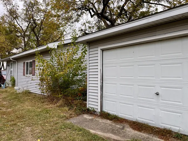 a small white house with a outdoor space
