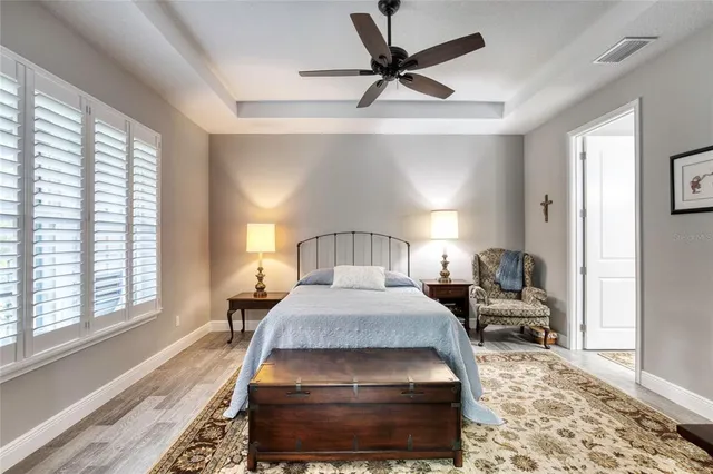 a bedroom with a large bed and a window