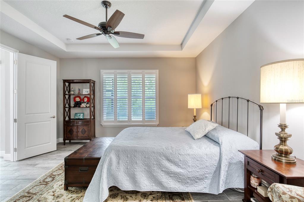 51 Wrendale Loop Ormond Beach, FL 32174 - Photo 24 of 58 a bedroom with a large bed and a window