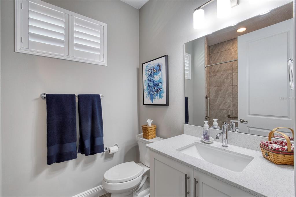 51 Wrendale Loop Ormond Beach, FL 32174 - Photo 30 of 58 a bathroom with a sink a toilet and shower